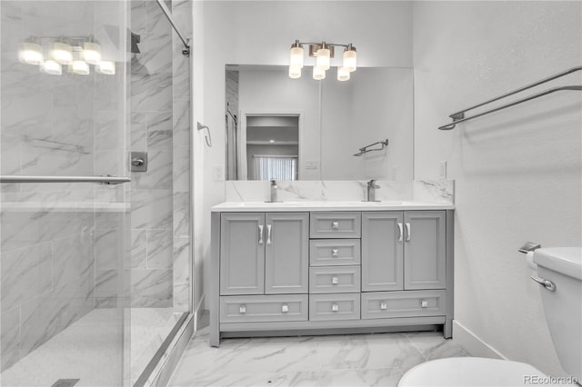 bathroom with vanity, toilet, and a shower with door