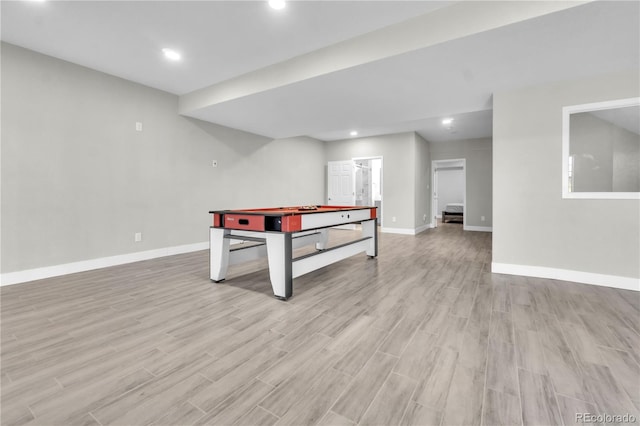 recreation room with light wood-type flooring