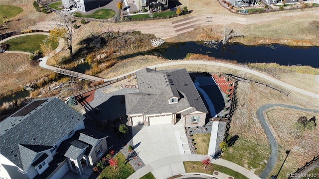 drone / aerial view with a water view