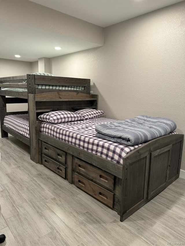 bedroom with light wood-type flooring