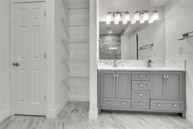 bathroom with an enclosed shower and vanity