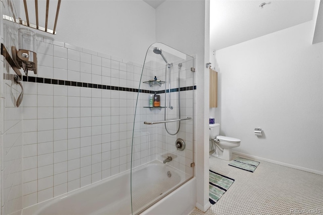 bathroom featuring tile patterned floors, toilet, tub / shower combination, and baseboards