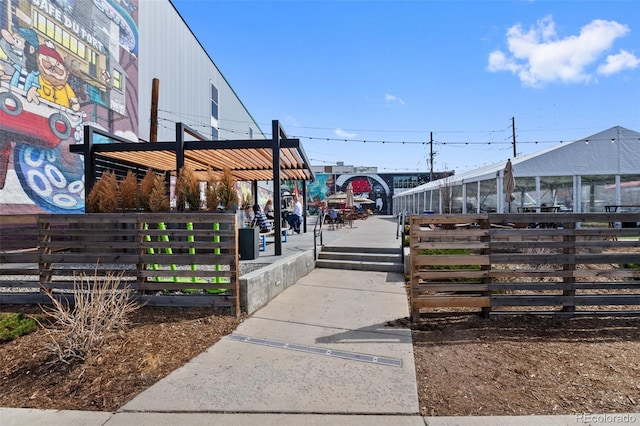 view of home's community with fence