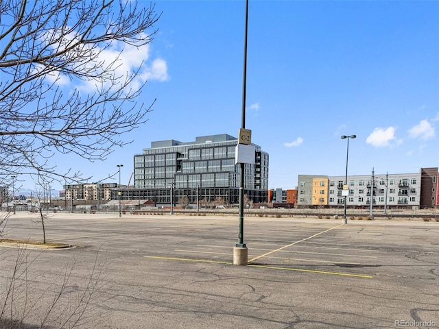 uncovered parking lot with a view of city