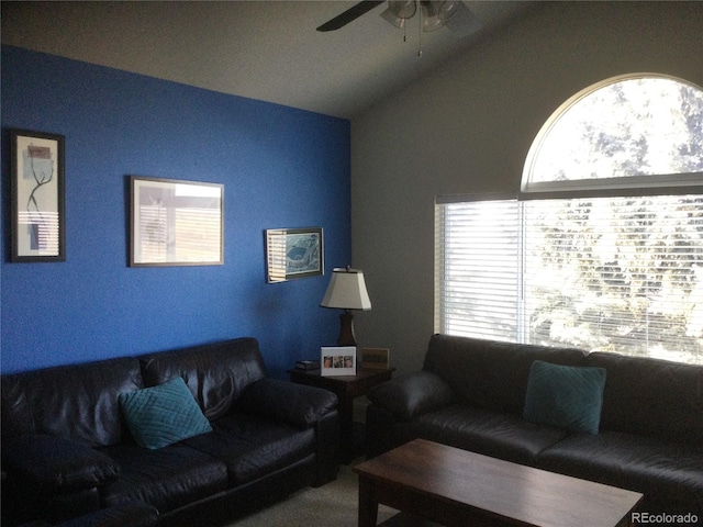 living room featuring ceiling fan and lofted ceiling