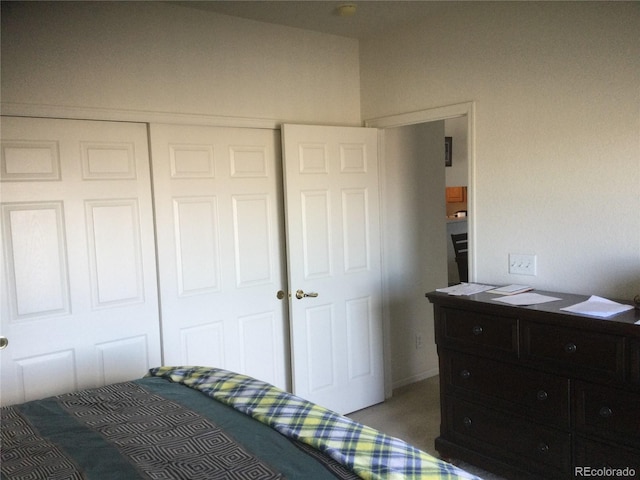 carpeted bedroom featuring a closet