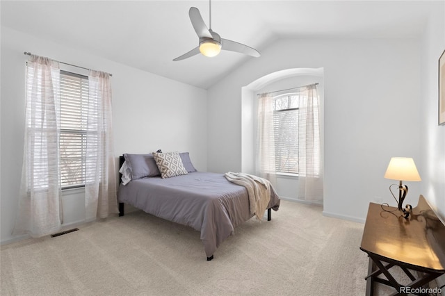 bedroom with light carpet, lofted ceiling, and ceiling fan