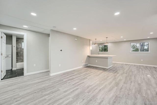 unfurnished living room with light hardwood / wood-style floors