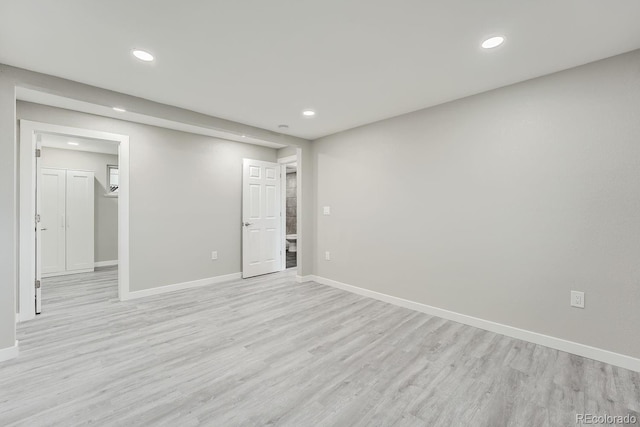 spare room featuring light hardwood / wood-style flooring