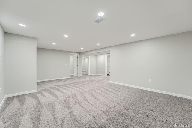 empty room with light colored carpet