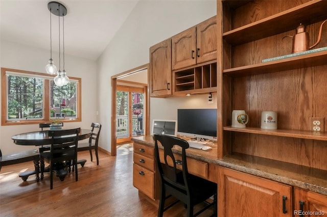 19165 Golden Arrow Cir, Monument, CO 80132 - office space with built in desk, vaulted ceiling, plenty of natural light, and wood finished floors