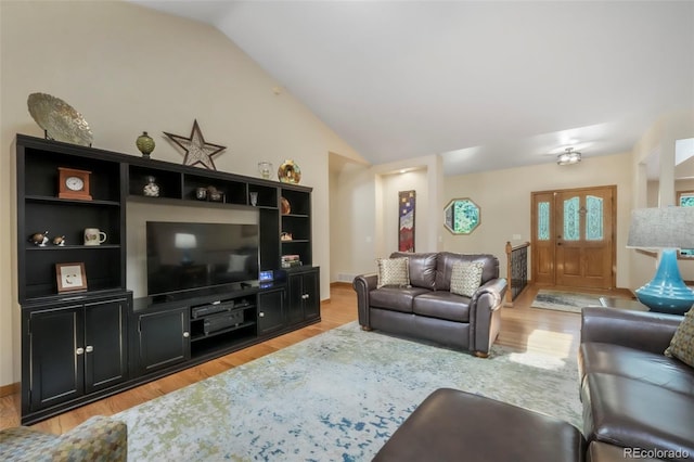 19165 Golden Arrow Cir, Monument, CO 80132 - living area with vaulted ceiling and light wood finished floors