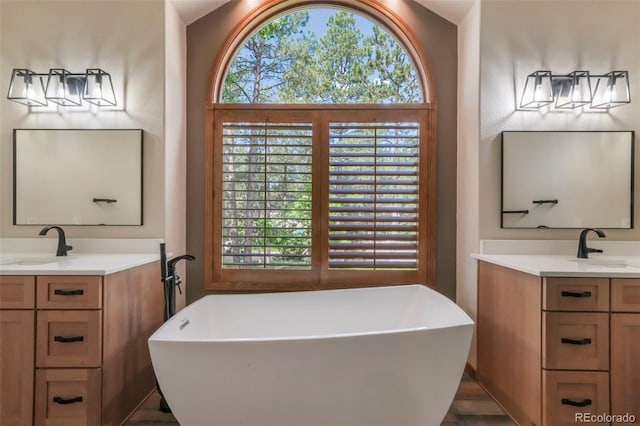 19165 Golden Arrow Cir, Monument, CO 80132 - full bath featuring two vanities and a soaking tub