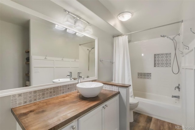 19165 Golden Arrow Cir, Monument, CO 80132 - bathroom with shower / bath combination with curtain, vanity, and wood finished floors