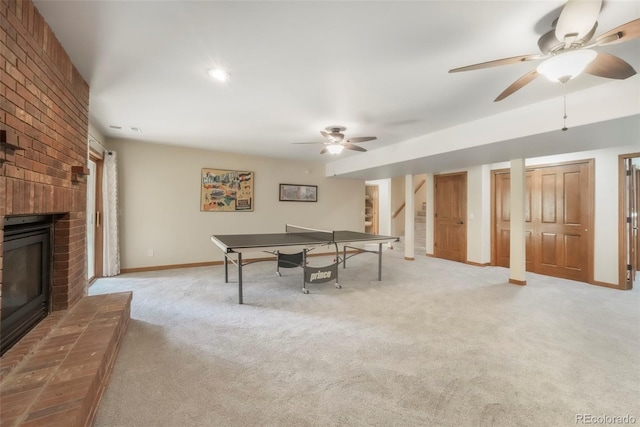 19165 Golden Arrow Cir, Monument, CO 80132 - recreation room featuring a ceiling fan, carpet flooring, and a fireplace