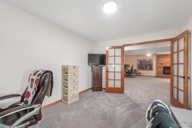 19165 Golden Arrow Cir, Monument, CO 80132 - home office with french doors, carpet, and a brick fireplace