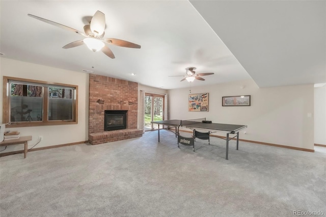 19165 Golden Arrow Cir, Monument, CO 80132 - rec room featuring a ceiling fan, carpet floors, and a brick fireplace