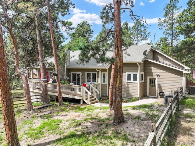 19165 Golden Arrow Cir, Monument, CO 80132 - rear view of house with a deck and a shingled roof