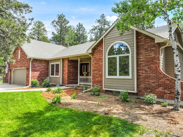 19165 Golden Arrow Cir, Monument, CO 80132 - ranch-style home featuring a front lawn, a shingled roof, concrete driveway, brick siding, and a garage