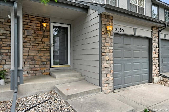2085 E 103rd Ave, Thornton, CO 80229 - entrance to property featuring an attached garage and stone siding