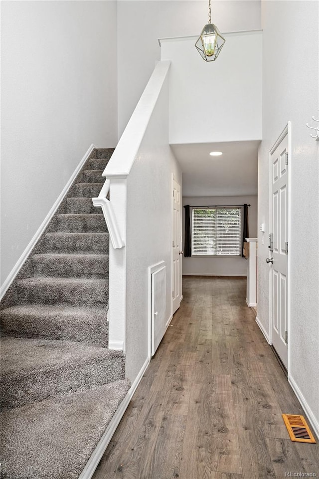 2085 E 103rd Ave, Thornton, CO 80229 - stairway featuring wood finished floors and baseboards