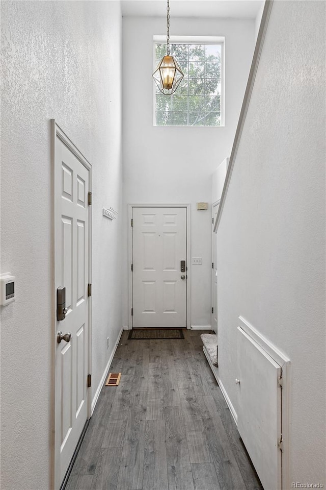 2085 E 103rd Ave, Thornton, CO 80229 - entryway featuring a towering ceiling and wood finished floors