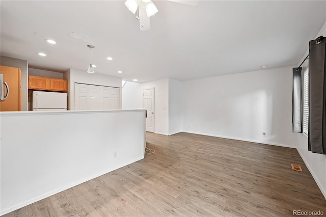 2085 E 103rd Ave, Thornton, CO 80229 - unfurnished living room featuring recessed lighting, wood finished floors, and ceiling fan