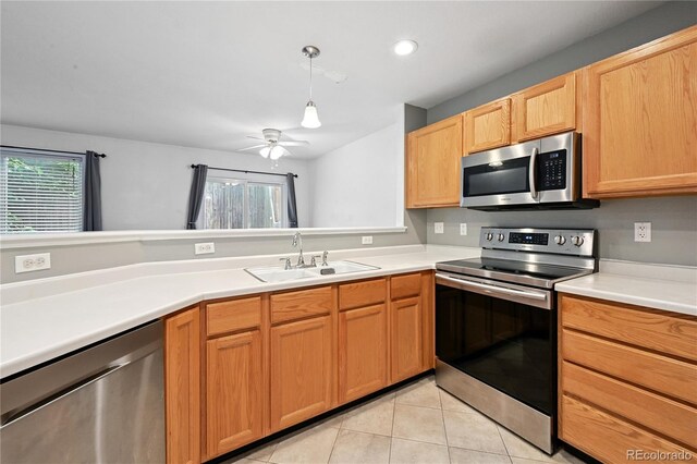 2085 E 103rd Ave, Thornton, CO 80229 - kitchen featuring stainless steel appliances, light tile patterned floors, ceiling fan, light countertops, and recessed lighting