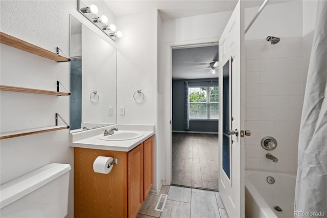 2085 E 103rd Ave, Thornton, CO 80229 - full bathroom featuring vanity, ceiling fan, shower / bath combo, and wood finished floors