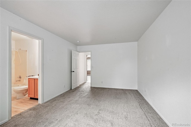 2085 E 103rd Ave, Thornton, CO 80229 - unfurnished bedroom featuring light colored carpet and ensuite bathroom
