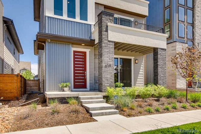 doorway to property featuring a balcony