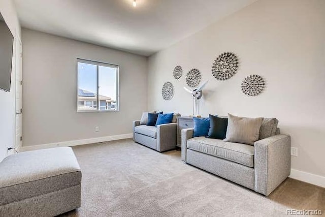 living room featuring light colored carpet