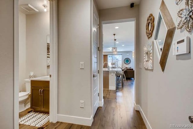 hall with dark wood-type flooring