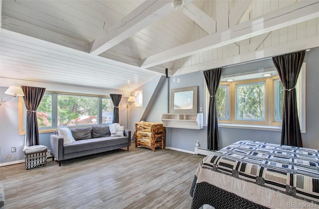 bedroom with baseboards, wood finished floors, a baseboard heating unit, and wood ceiling