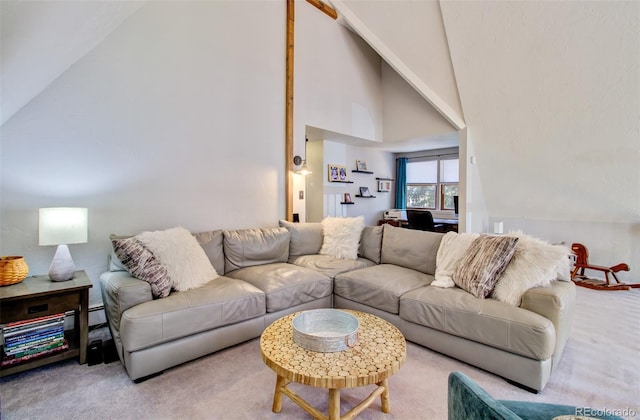 living room with carpet floors and high vaulted ceiling