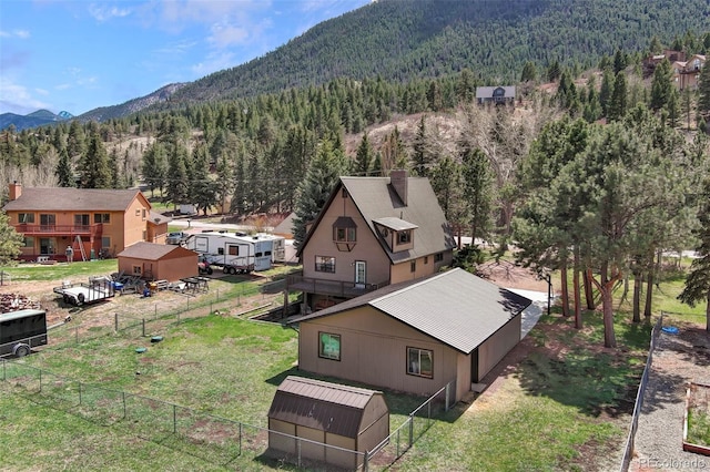 view from above of property featuring a forest and mountains