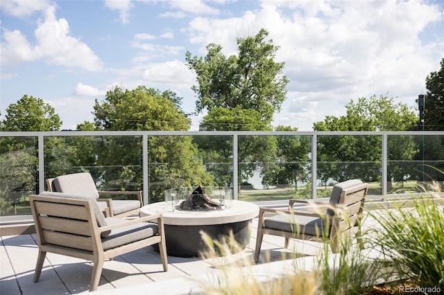 balcony with a patio and a fire pit