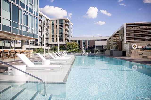 view of swimming pool with a patio area