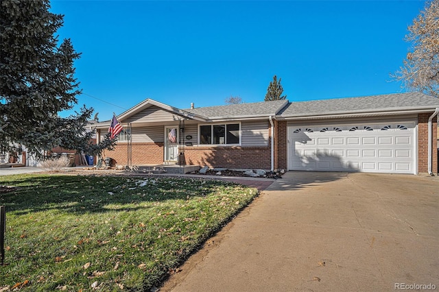 ranch-style home featuring a front lawn and a garage