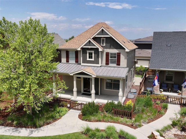 5080 Uinta St, Denver, CO 80238 - craftsman inspired home featuring covered porch, a standing seam roof, board and batten siding, a metal roof, and an outdoor living space