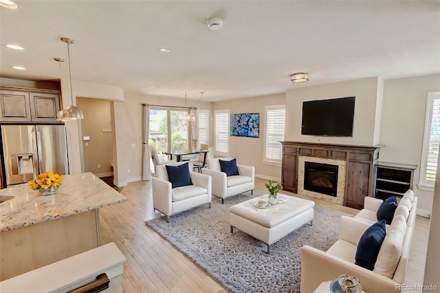 5080 Uinta St, Denver, CO 80238 - living area with recessed lighting, light wood-style floors, and a high end fireplace