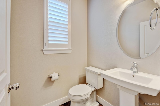 5080 Uinta St, Denver, CO 80238 - half bathroom featuring toilet and baseboards