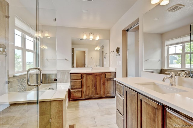 5080 Uinta St, Denver, CO 80238 - bathroom featuring two vanities, a bath, and a stall shower