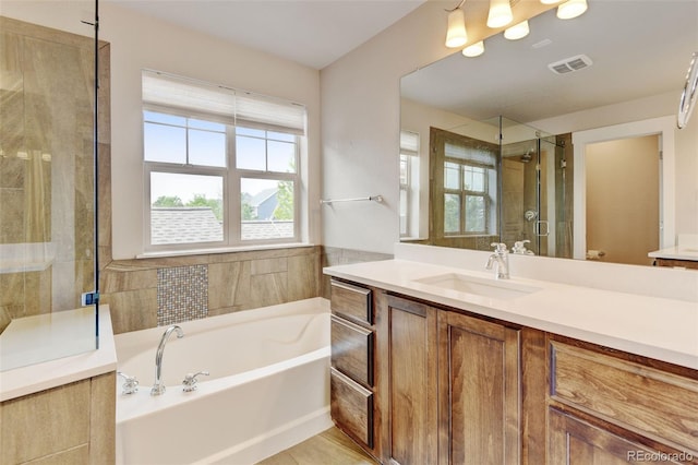 5080 Uinta St, Denver, CO 80238 - bathroom featuring a bath, vanity, and a tile shower