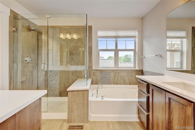 5080 Uinta St, Denver, CO 80238 - full bathroom featuring vanity, a bath, and a stall shower
