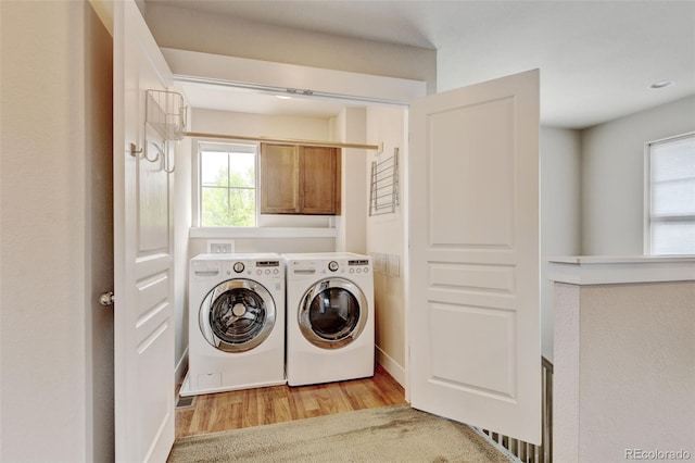 5080 Uinta St, Denver, CO 80238 - washroom with cabinet space, washing machine and clothes dryer, and light wood finished floors