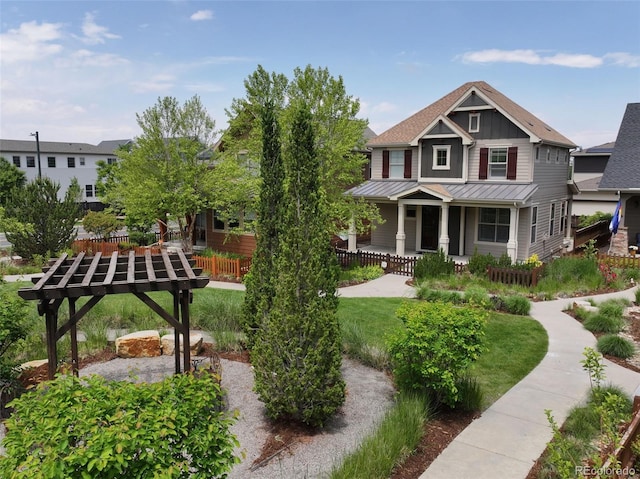 5080 Uinta St, Denver, CO 80238 - view of front facade with board and batten siding, a standing seam roof, a porch, and a metal roof
