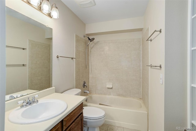 full bathroom with tile patterned floors, vanity, toilet, and tiled shower / bath