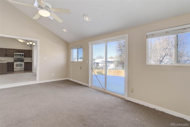 empty room with ceiling fan, carpet, and vaulted ceiling