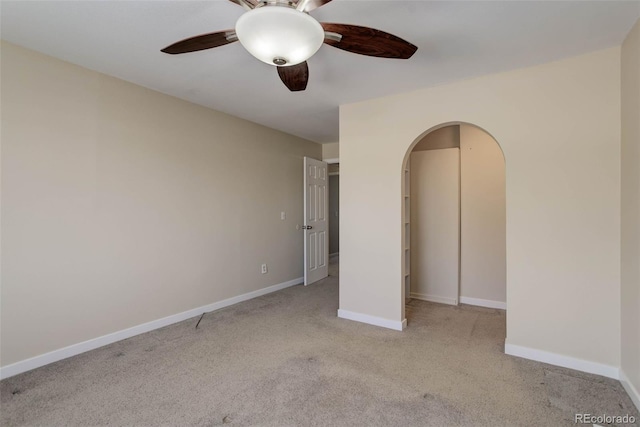 unfurnished bedroom featuring ceiling fan and light colored carpet